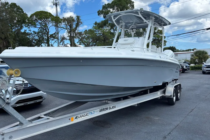  Yacht Photos Pics 2026 Glasstream 280 Pro-XS boat on trailer, parked outdoors.