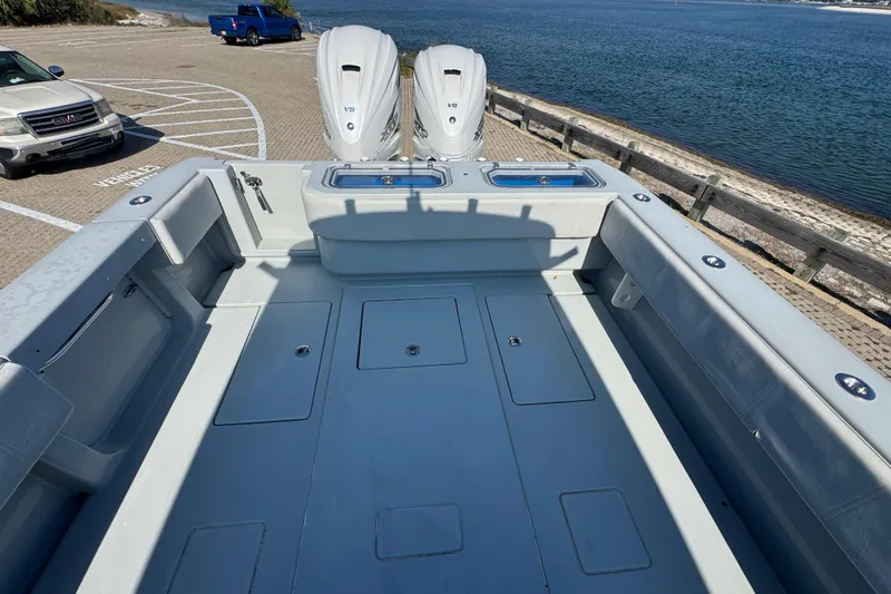 Free Spear It Yacht Photos Pics 2016 Contender 35 ST boat with twin V8 engines, parked by the waterfront.