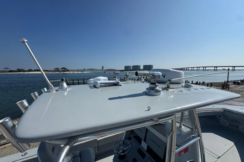 Free Spear It Yacht Photos Pics 2016 Contender 35 ST boat with advanced navigation equipment, docked by a scenic waterfront.