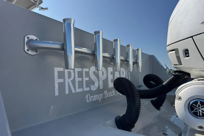 Free Spear It Yacht Photos Pics 2016 Contender 35 ST boat with rod holders and engine, labeled "Freespirit" in Orange Beach.