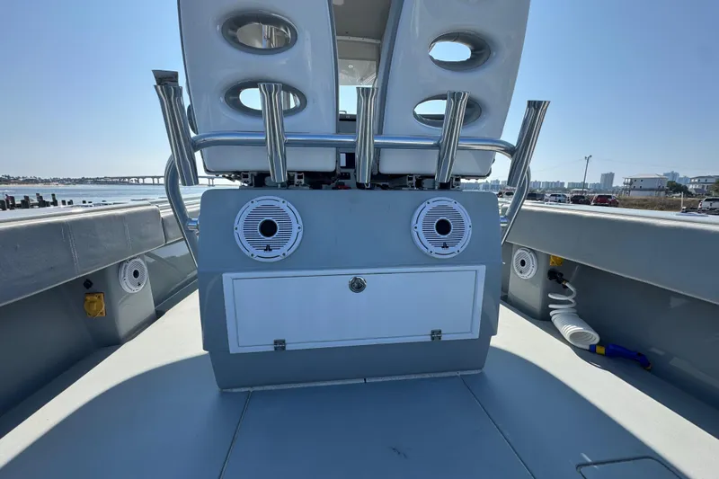 Free Spear It Yacht Photos Pics 2016 Contender 35 ST boat interior with speakers and storage, docked by the waterfront.