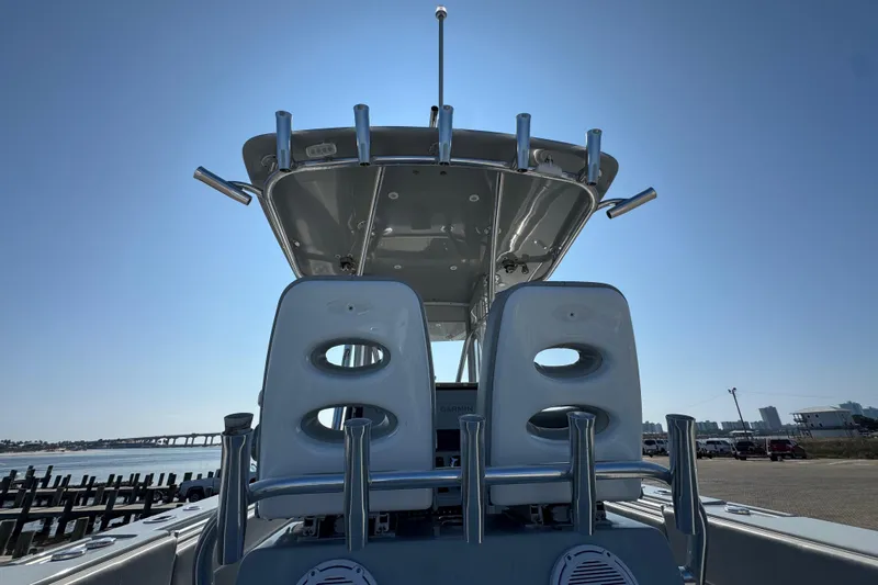 Free Spear It Yacht Photos Pics 2016 Contender 35 ST boat with dual seats and T-top under clear sky.