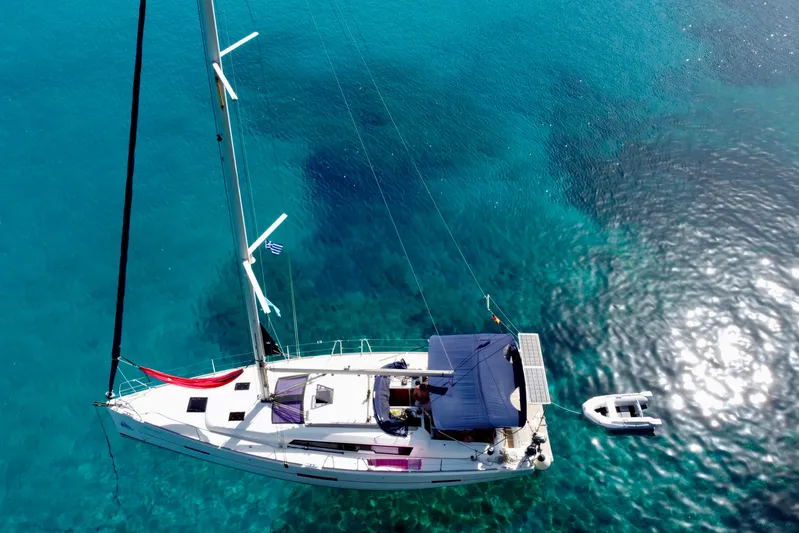  Yacht Photos Pics Aerial view of 2015 Dufour 41.2 GL yacht on clear turquoise water.