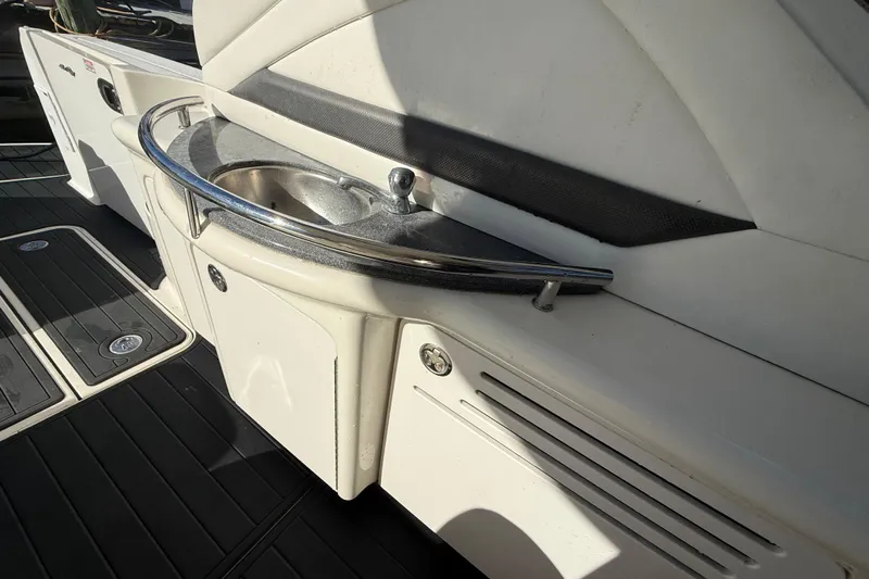 Yacht Photos Pics 2005 Sea Ray 390 Sundancer boat interior with sink and storage area.