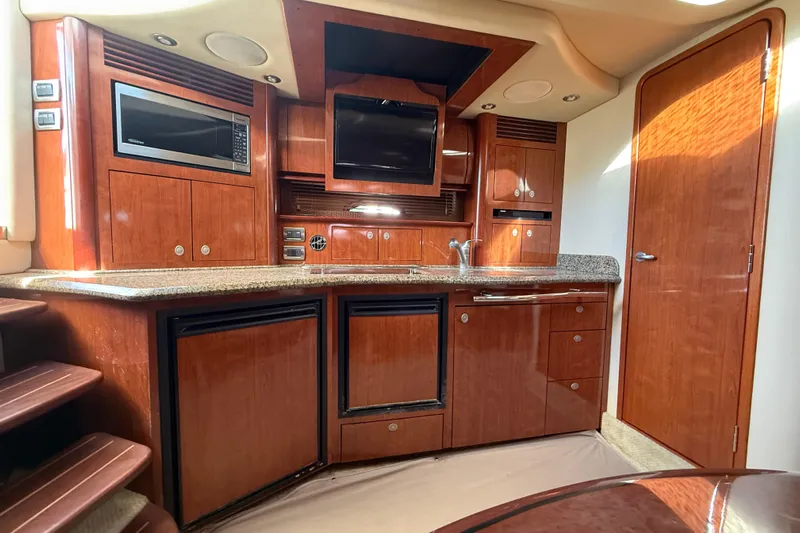  Yacht Photos Pics Luxurious 2005 Sea Ray 390 Sundancer yacht interior with wood cabinetry and modern amenities.
