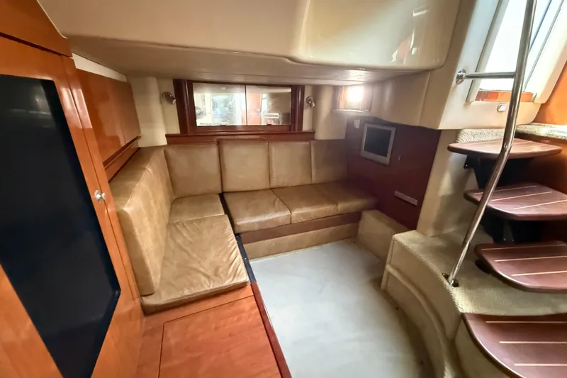  Yacht Photos Pics 2005 Sea Ray 390 Sundancer interior with leather seating and wooden accents.