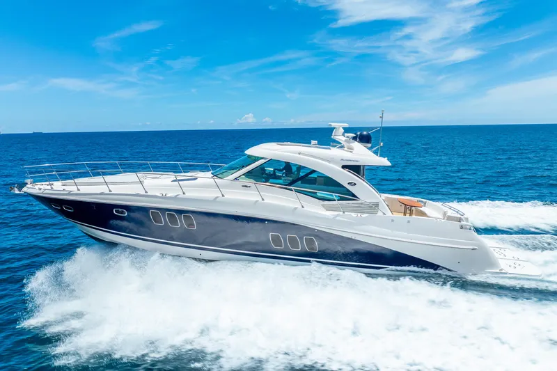 Brinee Yacht Photos Pics 2008 Sea Ray 60 Sundancer yacht cruising on open blue ocean.