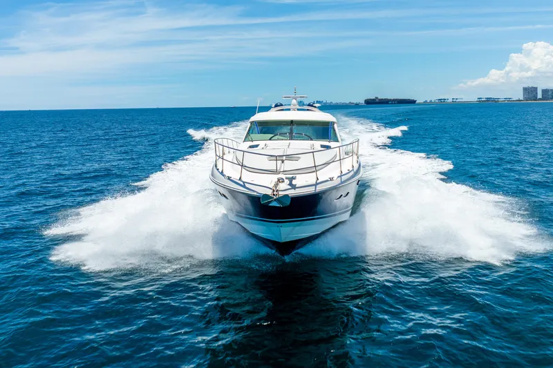 Brinee Yacht Photos Pics 2008 Sea Ray 60 Sundancer yacht cruising on open blue ocean waters.