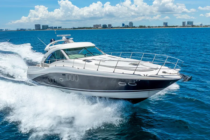 Brinee Yacht Photos Pics 2008 Sea Ray 60 Sundancer yacht cruising on open water under a clear sky.