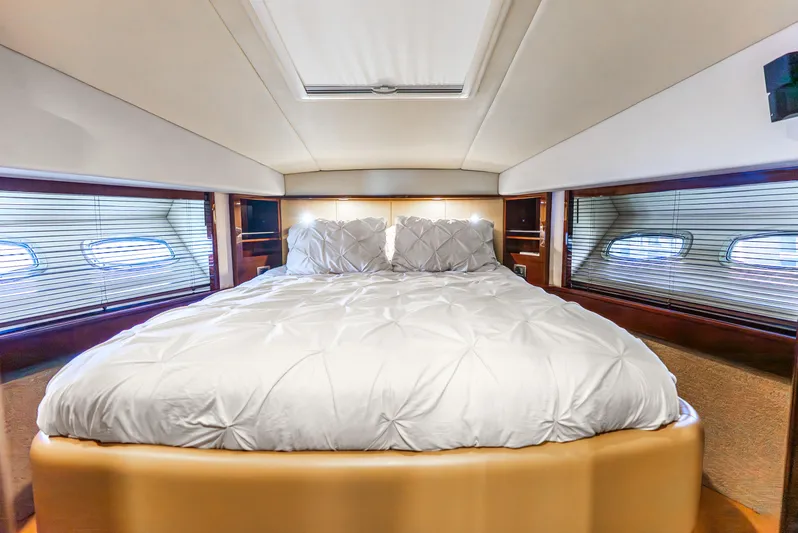 Brinee Yacht Photos Pics Luxurious bedroom interior of 2008 Sea Ray 60 Sundancer yacht with plush bedding.