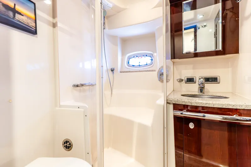 Brinee Yacht Photos Pics Luxurious bathroom interior of 2008 Sea Ray 60 Sundancer yacht with shower and sink.