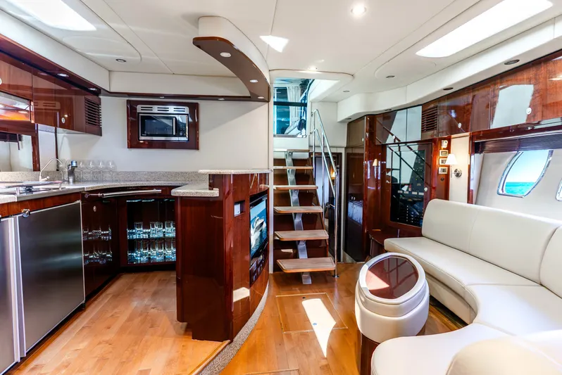 Brinee Yacht Photos Pics Luxurious interior of 2008 Sea Ray 60 Sundancer yacht with modern kitchen and seating area.