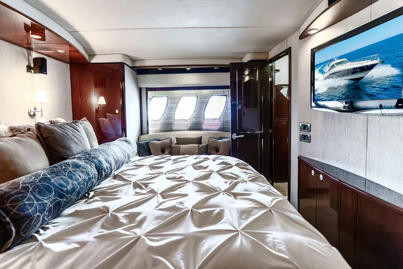 Brinee Yacht Photos Pics Luxurious bedroom interior of 2008 Sea Ray 60 Sundancer yacht with elegant bedding and modern decor.