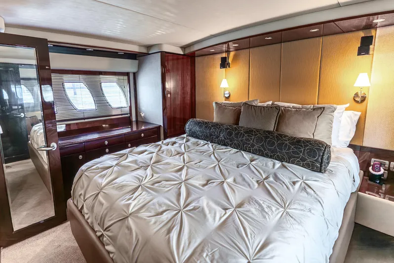 Brinee Yacht Photos Pics Luxurious bedroom interior of 2008 Sea Ray 60 Sundancer yacht with elegant bedding and lighting.