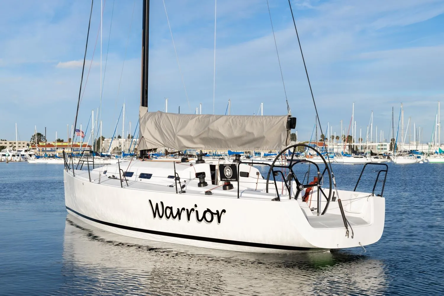 2008 J Boats J/122 sailboat named "Warrior" docked in a marina.