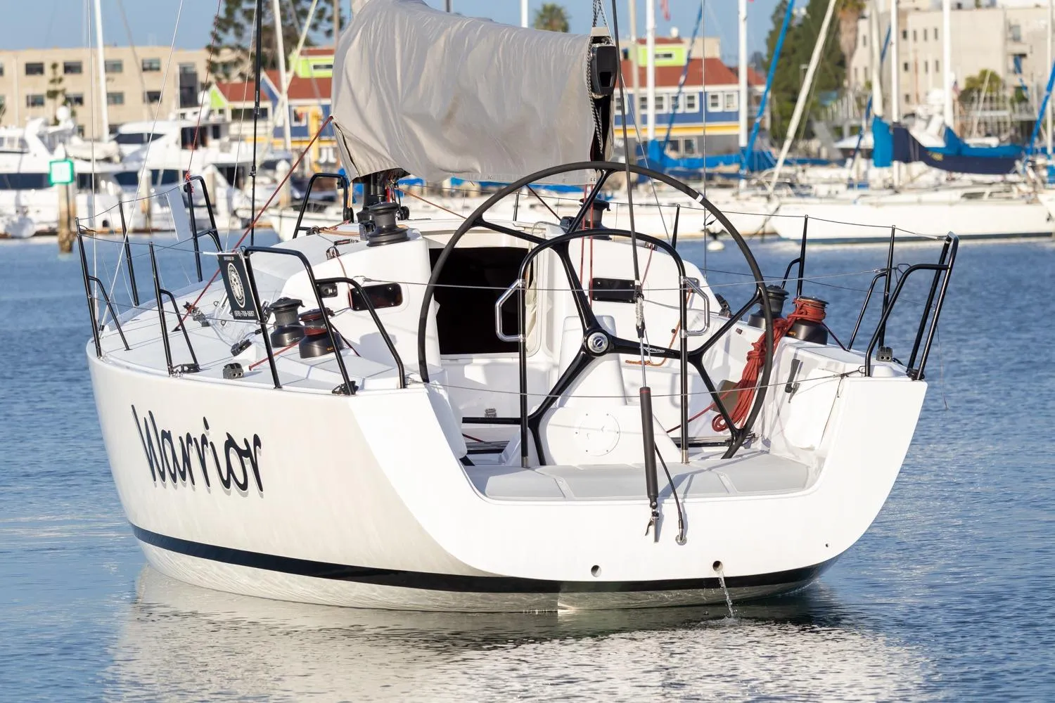 2008 J Boats J/122 sailboat named Warrior docked in a marina.