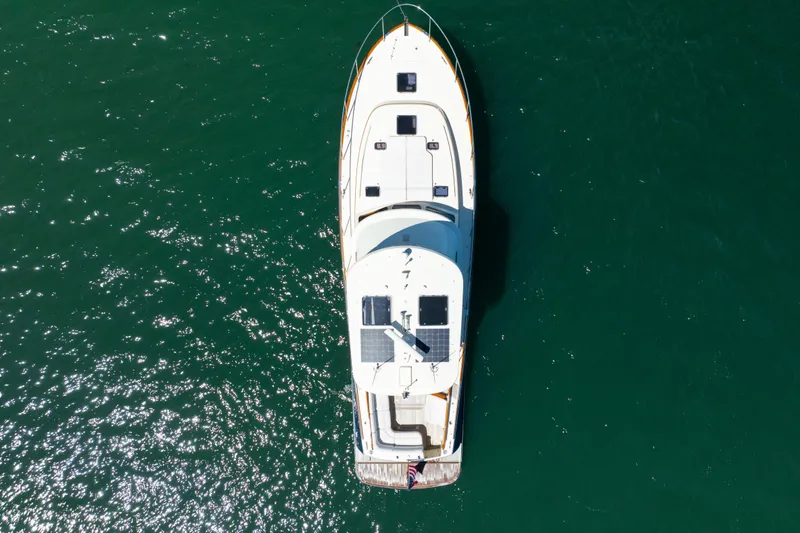 Barefoot Yacht Photos Pics Overhead view of 2014 Hinckley Talaria 48 Flybridge yacht on open water.