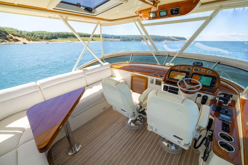 Barefoot Yacht Photos Pics Luxurious 2014 Hinckley Talaria 48 Flybridge interior with scenic ocean view.