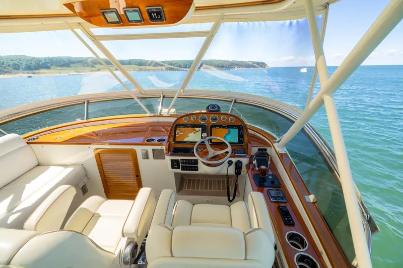 Barefoot Yacht Photos Pics Helm of 2014 Hinckley Talaria 48 Flybridge yacht with ocean view.