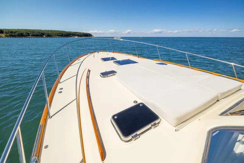 Barefoot Yacht Photos Pics 2014 Hinckley Talaria 48 Flybridge yacht deck on open water, clear sky.