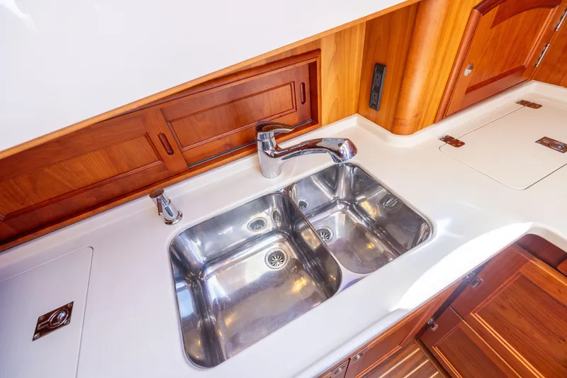 Barefoot Yacht Photos Pics Stainless steel sink in 2014 Hinckley Talaria 48 Flybridge yacht kitchen.
