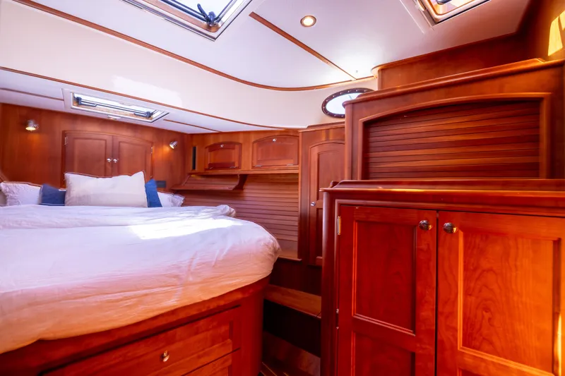 Barefoot Yacht Photos Pics Luxurious wood-finished cabin interior of 2014 Hinckley Talaria 48 Flybridge yacht.