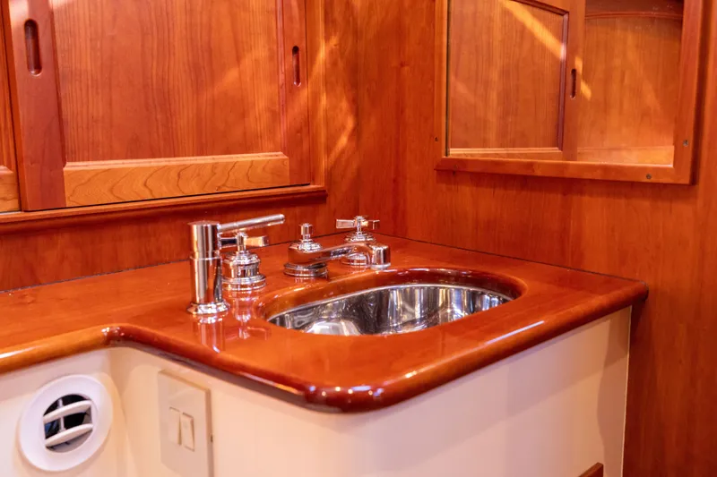 Barefoot Yacht Photos Pics Luxurious wooden bathroom interior of 2014 Hinckley Talaria 48 Flybridge yacht.
