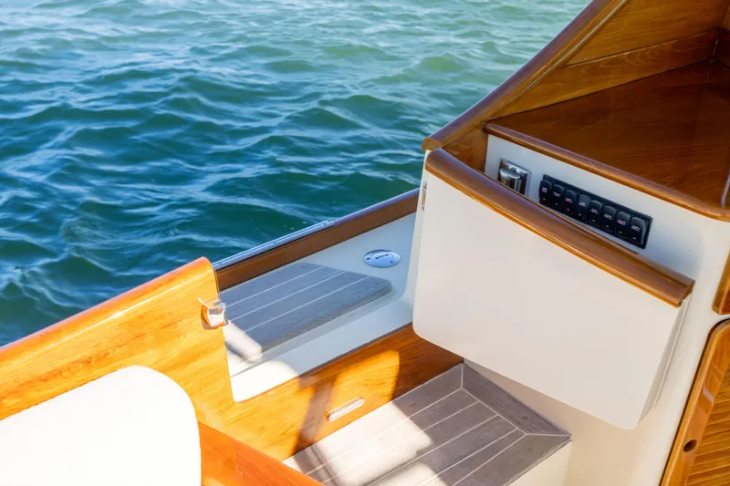 Barefoot Yacht Photos Pics 2014 Hinckley Talaria 48 Flybridge deck with wood finish and control panel.