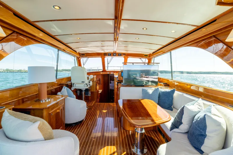 Barefoot Yacht Photos Pics Luxurious interior of 2014 Hinckley Talaria 48 Flybridge yacht with elegant wood finish.
