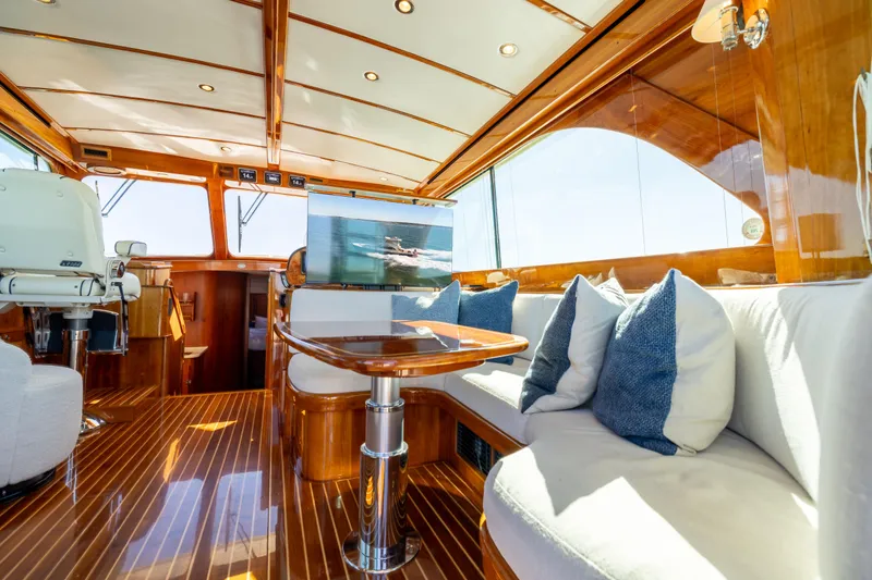 Barefoot Yacht Photos Pics Luxurious interior of 2014 Hinckley Talaria 48 Flybridge yacht with elegant wood finish.