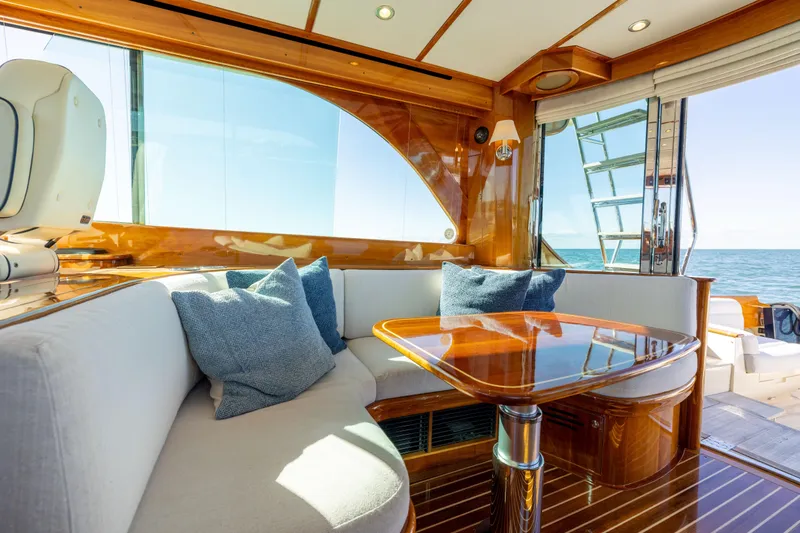 Barefoot Yacht Photos Pics Luxurious interior of 2014 Hinckley Talaria 48 Flybridge yacht with ocean view.