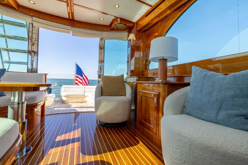 Barefoot Yacht Photos Pics Luxurious interior of 2014 Hinckley Talaria 48 Flybridge yacht with ocean view.