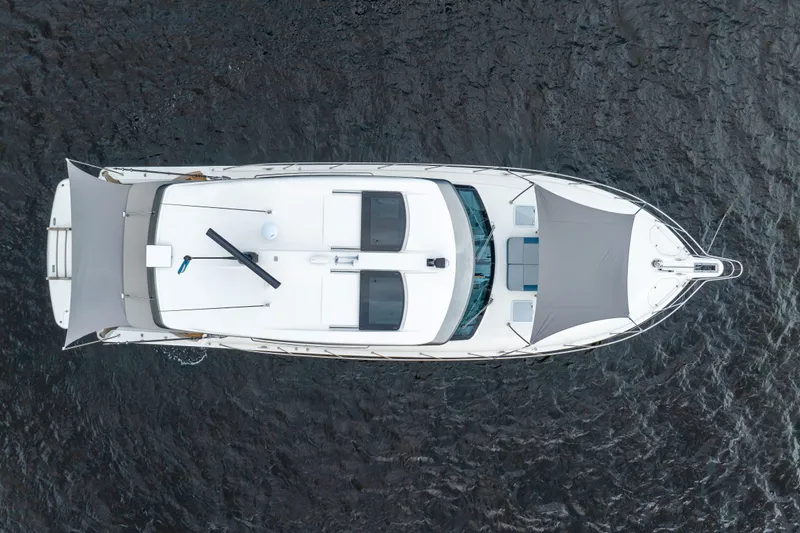 Sapphire Yacht Photos Pics Aerial view of 2022 Riviera 575 SUV yacht on water.