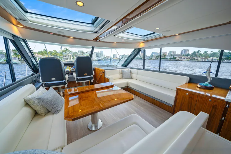 Sapphire Yacht Photos Pics Luxurious interior of 2022 Riviera 575 SUV yacht with elegant seating and panoramic windows.