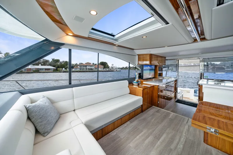 Sapphire Yacht Photos Pics Luxurious interior of 2022 Riviera 575 SUV yacht with modern design and waterfront view.