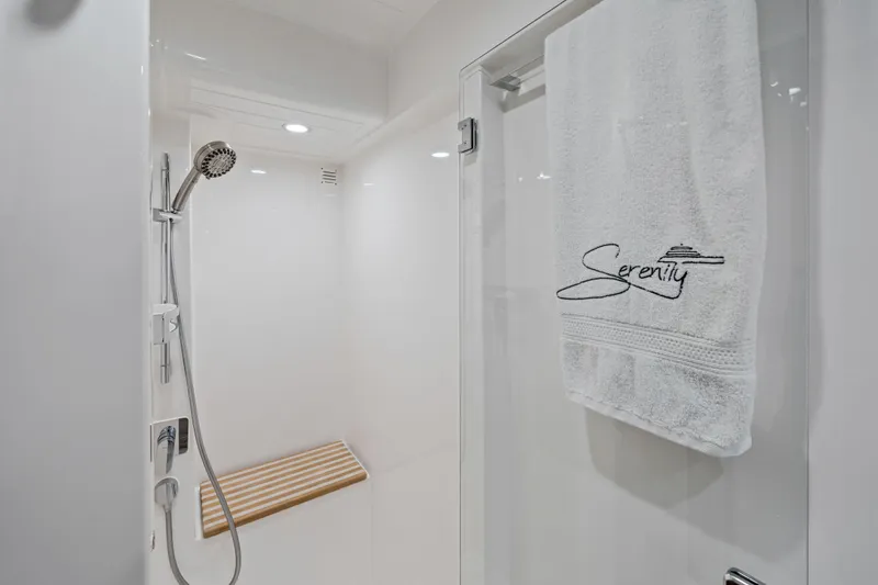 Sapphire Yacht Photos Pics Luxurious shower in 2022 Riviera 575 SUV yacht with "Serenity" towel.