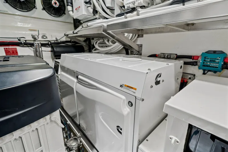 Sapphire Yacht Photos Pics Engine room of 2022 Riviera 575 SUV with Cummins generator and mechanical components.