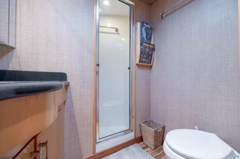 Wet Hooker Yacht Photos Pics Bathroom interior of 2003 Hatteras 60 Convertible yacht with shower and toilet.