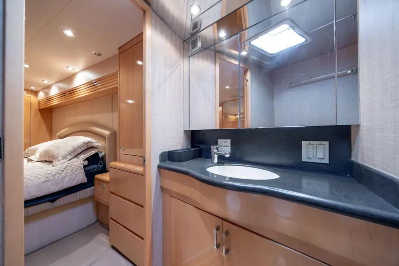 Wet Hooker Yacht Photos Pics Luxurious bathroom and bedroom interior of 2003 Hatteras 60 Convertible yacht.