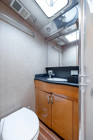 Wet Hooker Yacht Photos Pics Luxurious bathroom in 2003 Hatteras 60 Convertible yacht with modern fixtures.