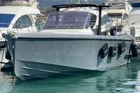 2012 Fjord 36' Open yacht docked in a marina, surrounded by other boats.