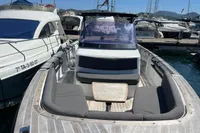 2012 Fjord 36' Open boat docked at marina, featuring spacious seating and sleek design.