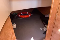 Interior cabin of 2012 Fjord 36' Open boat with life preserver and ropes.