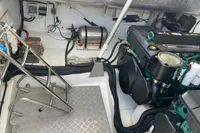 Engine room of a 2012 Fjord 36' Open boat, featuring mechanical components and wiring.