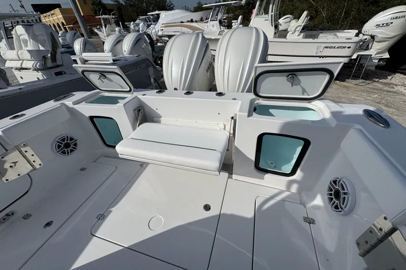  Yacht Photos Pics 2026 Sportsman Open 302 Center Console boat interior with seating and storage compartments.