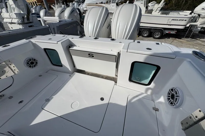  Yacht Photos Pics 2026 Sportsman Open 302 Center Console boat interior with storage and speakers.