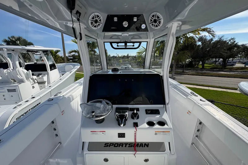  Yacht Photos Pics 2026 Sportsman Open 302 Center Console boat interior with modern dashboard and controls.