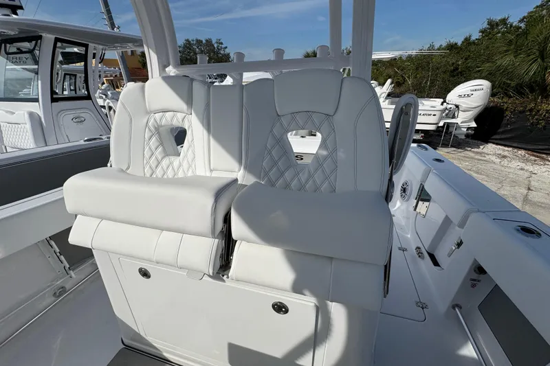  Yacht Photos Pics 2026 Sportsman Open 302 Center Console boat with luxurious white seating and modern design.