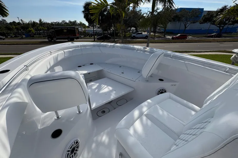  Yacht Photos Pics 2026 Sportsman Open 302 Center Console boat interior with white seating and modern design.