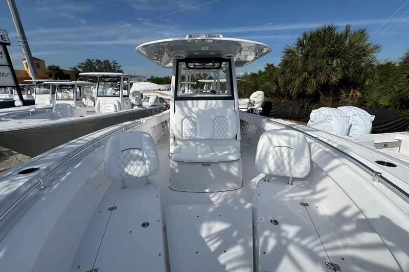  Yacht Photos Pics 2026 Sportsman Open 302 Center Console boat with sleek design and spacious seating.